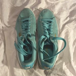 Teal blue Puma sneakers. Never worn. No holes, tears, or stains.